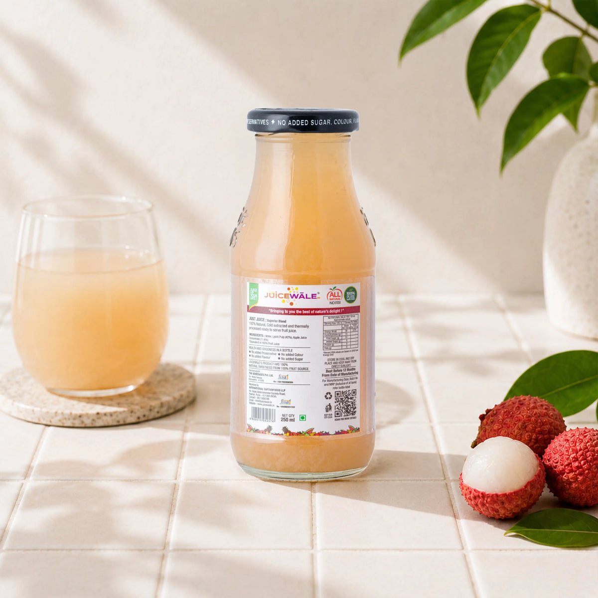 Frut Jus Litchi juice bottle label close-up